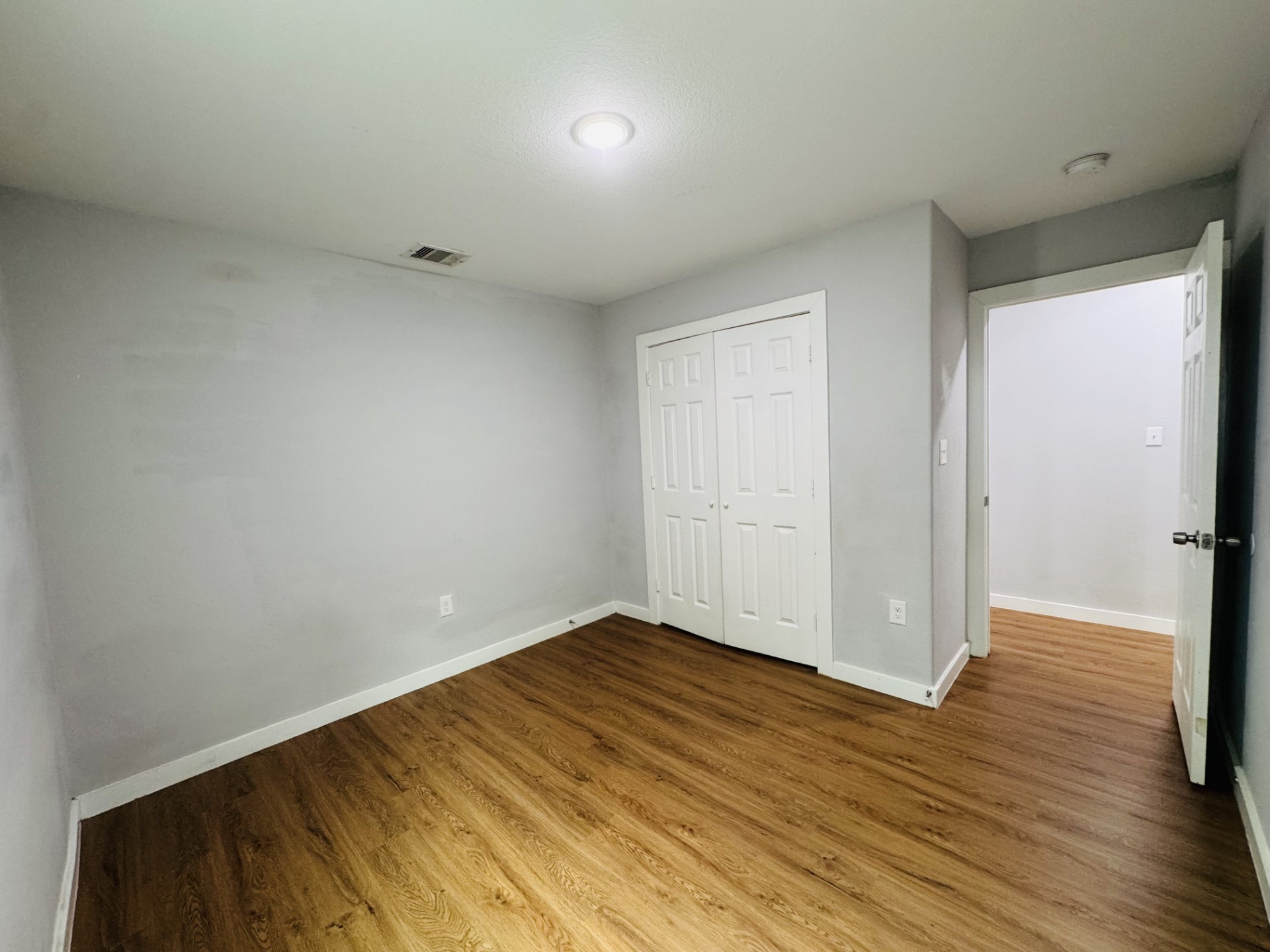 6606 Haight Street Houston, TX 77028 - Photo 6 of 23 wooden floor in an empty room