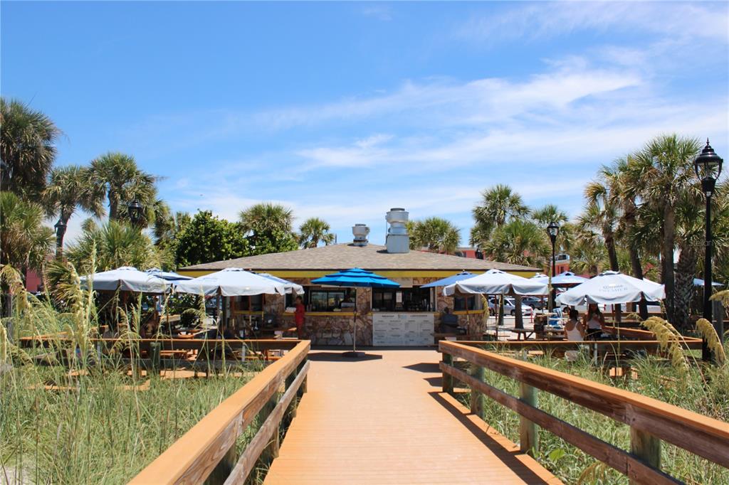 6800 Sunset Way, Unit 1708 St. Pete Beach, FL 33706 - Photo 15 of 15 a view of swimming pool with outdoor seating
