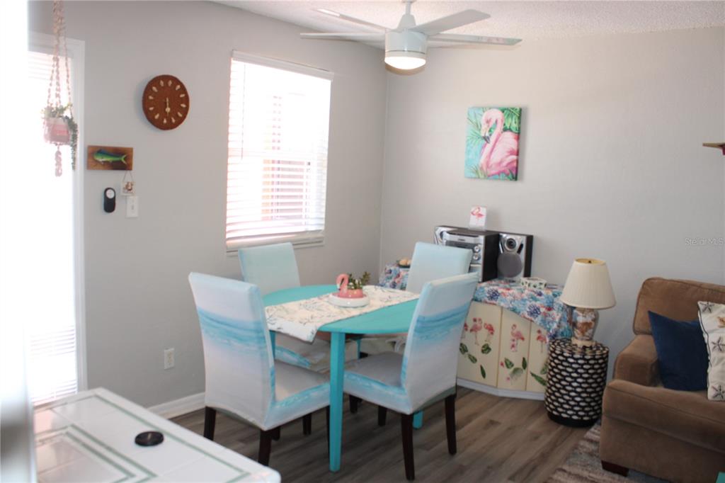 6800 Sunset Way, Unit 1708 St. Pete Beach, FL 33706 - Photo 5 of 15 a dining room with furniture and a window