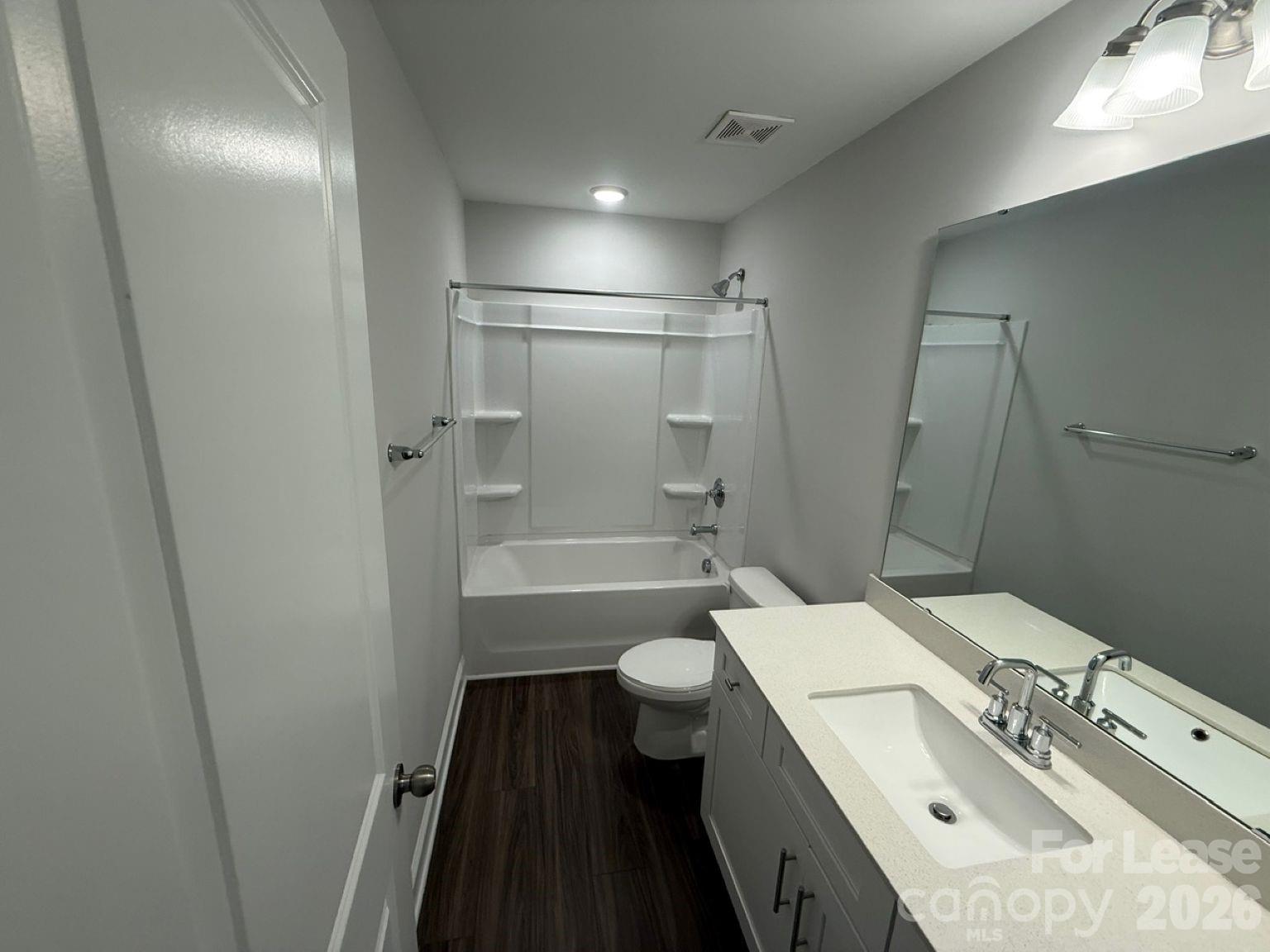 5593 Stafford Road Charlotte, NC 28215 - Photo 16 of 23 a bathroom with a sink a toilet and shower
