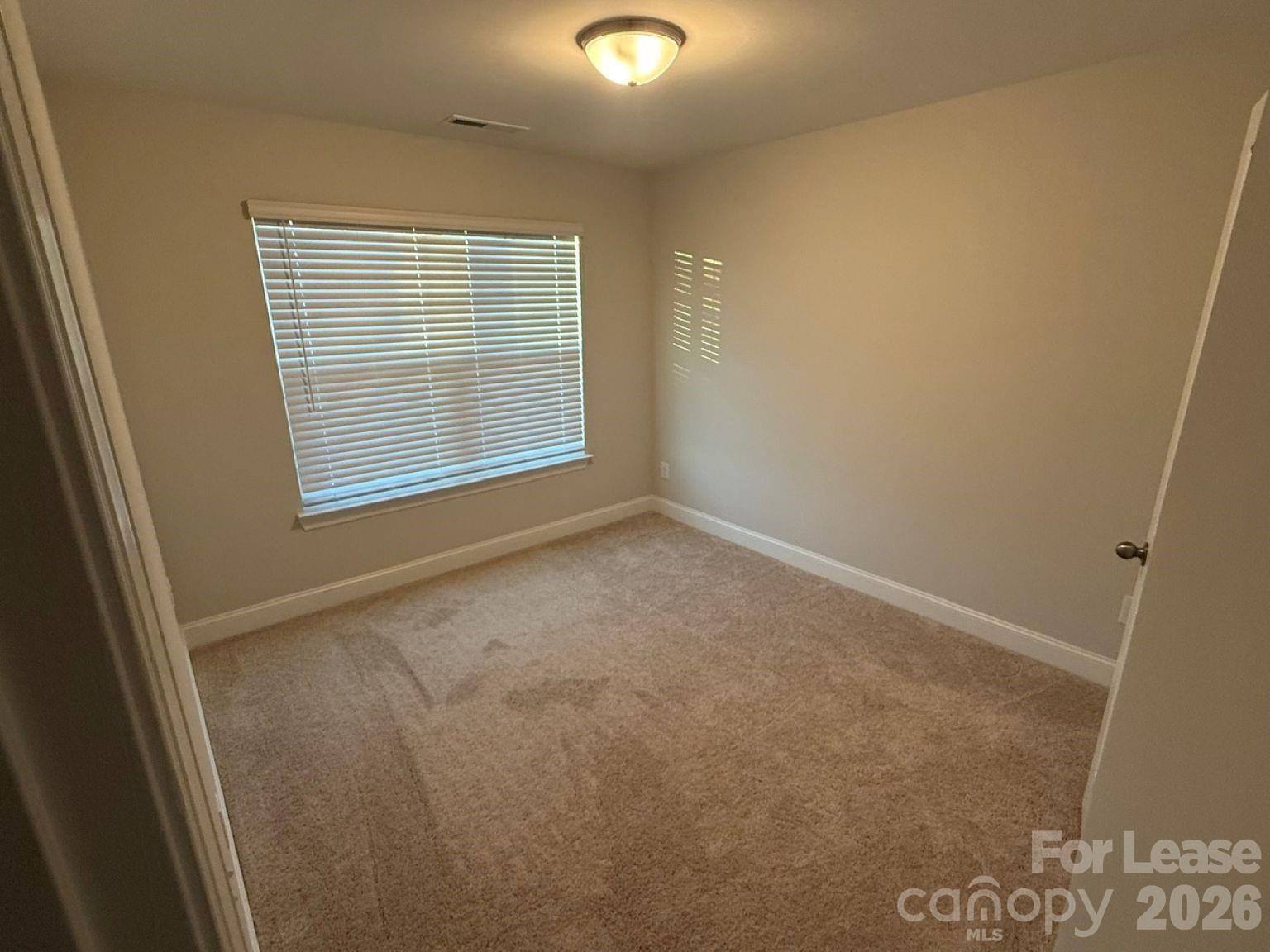 5593 Stafford Road Charlotte, NC 28215 - Photo 17 of 23 a view of an empty room with a window
