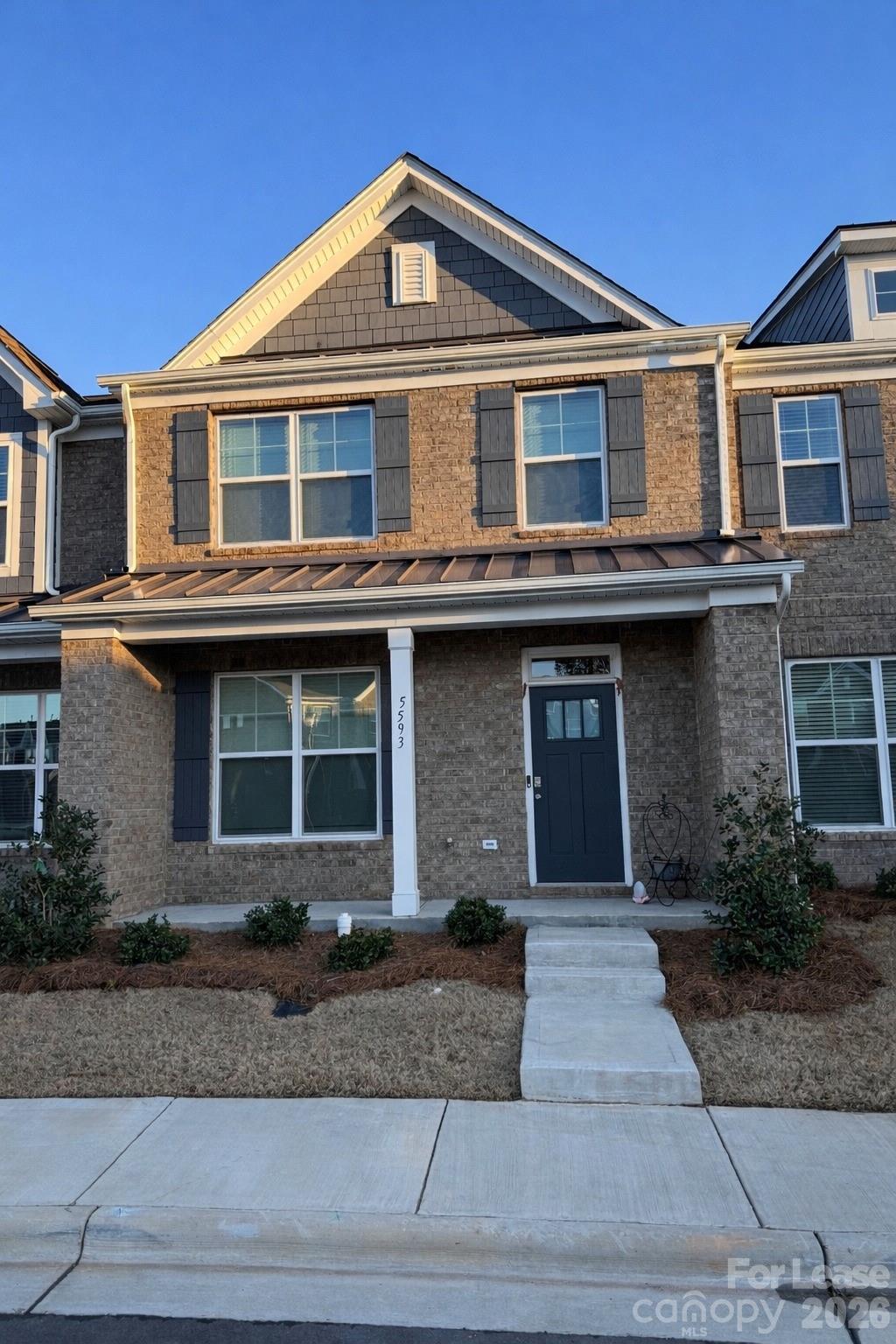 5593 Stafford Road Charlotte, NC 28215 - Photo 2 of 23 a front view of a house with a yard and garage