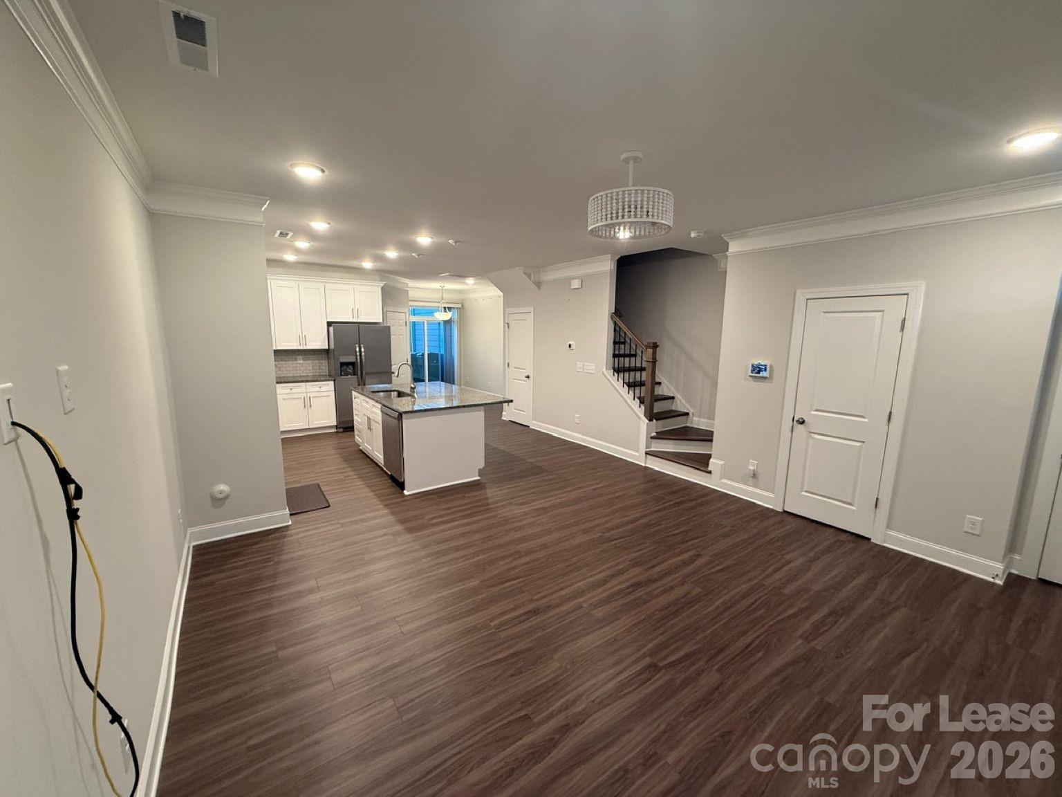 5593 Stafford Road Charlotte, NC 28215 - Photo 5 of 23 a view of kitchen with cabinets and wooden floor