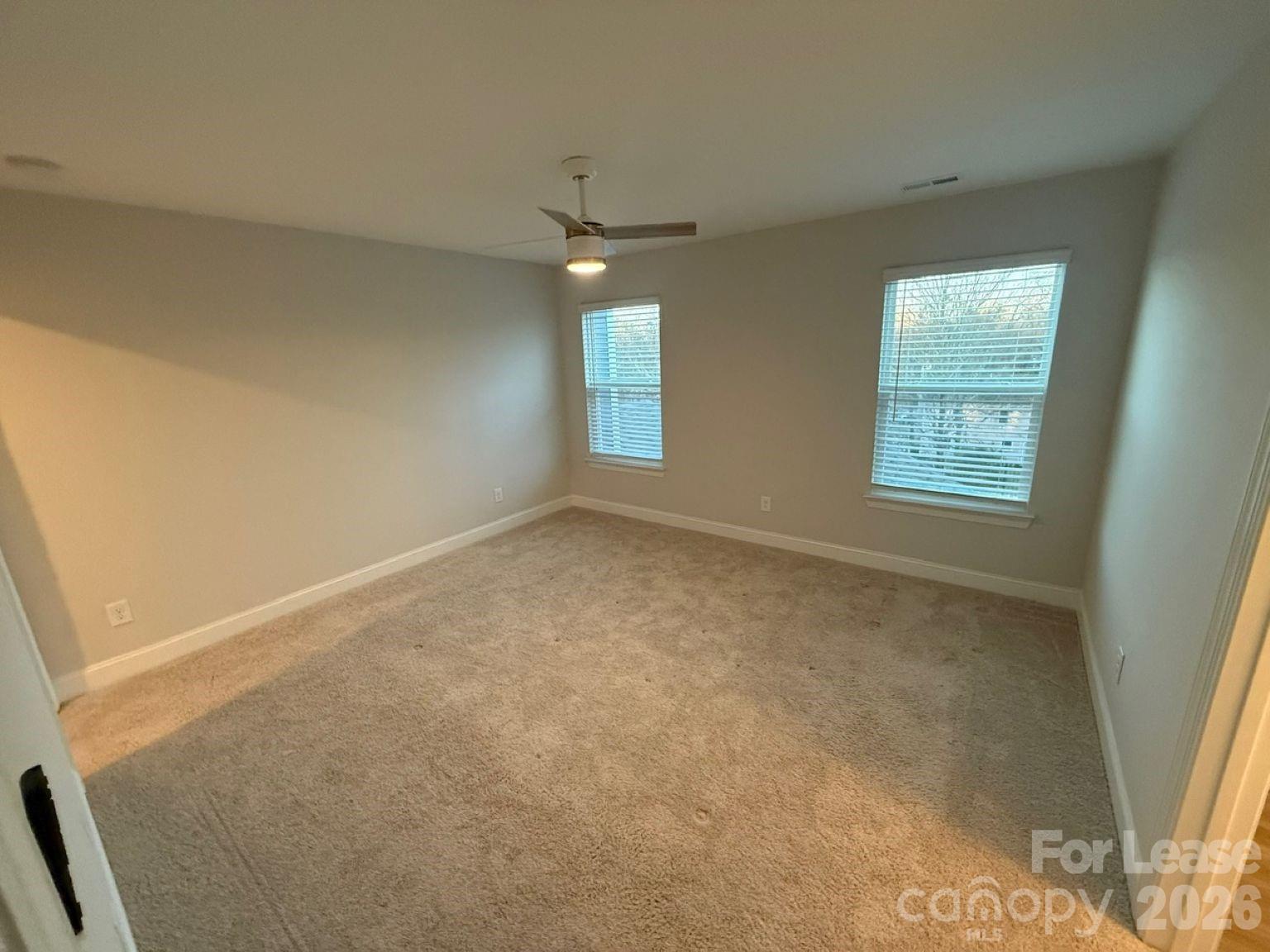 5593 Stafford Road Charlotte, NC 28215 - Photo 10 of 23 an empty room with windows and closet