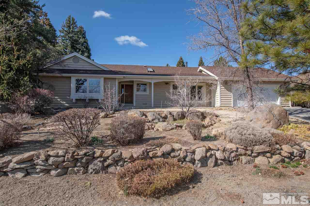 13100 Fellowship Way Reno, NV 89511 - Photo 1 of 40 a front view of a house with a yard