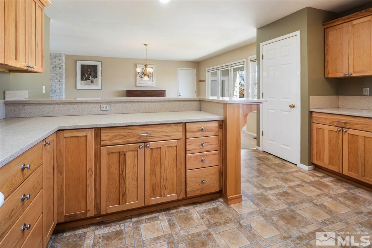 13100 Fellowship Way Reno, NV 89511 - Photo 12 of 40 a kitchen with stainless steel appliances a sink and cabinets