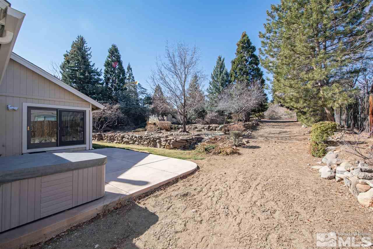 13100 Fellowship Way Reno, NV 89511 - Photo 27 of 40 a view of a backyard with large trees