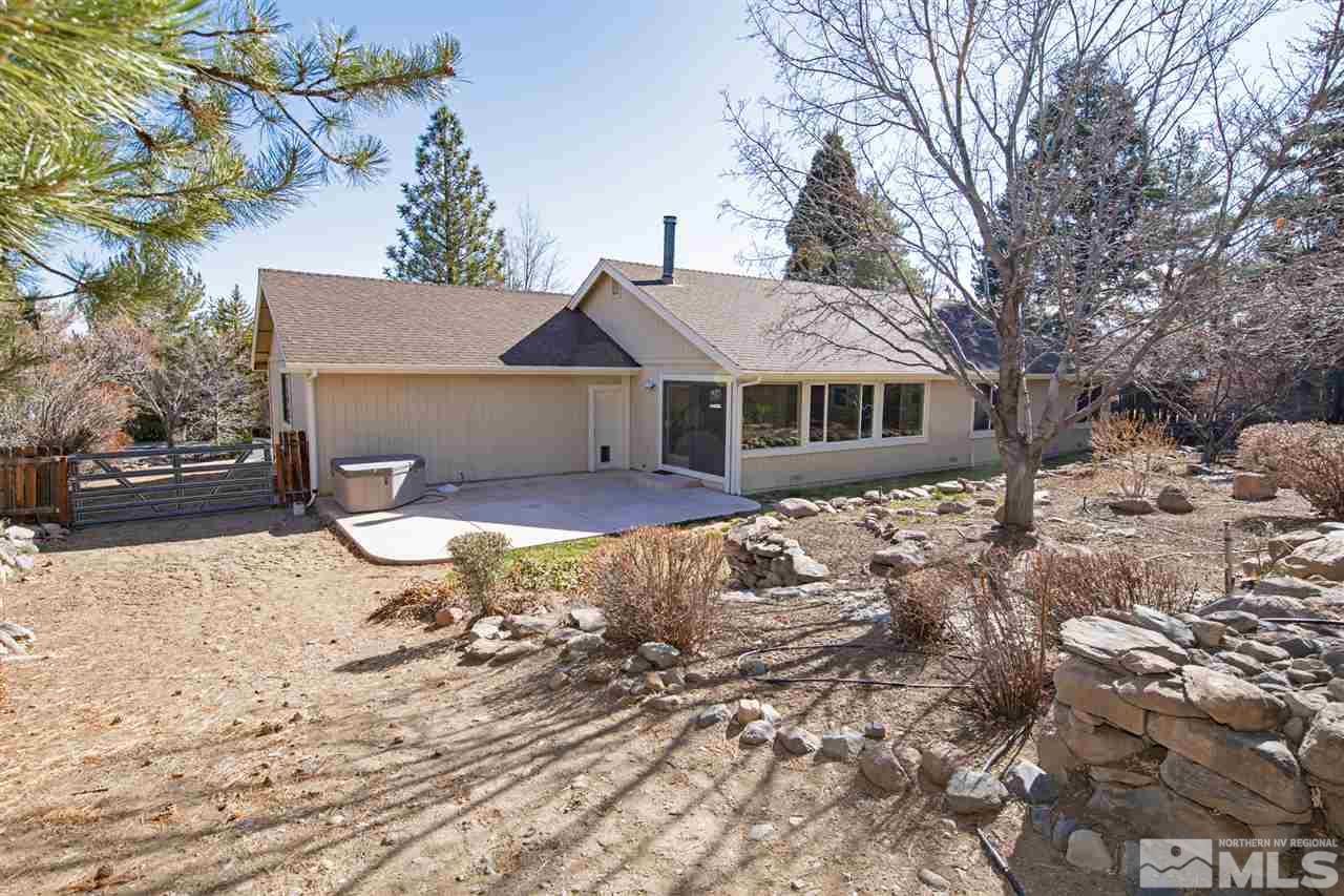 13100 Fellowship Way Reno, NV 89511 - Photo 30 of 40 a front view of a house with a yard covered with snow