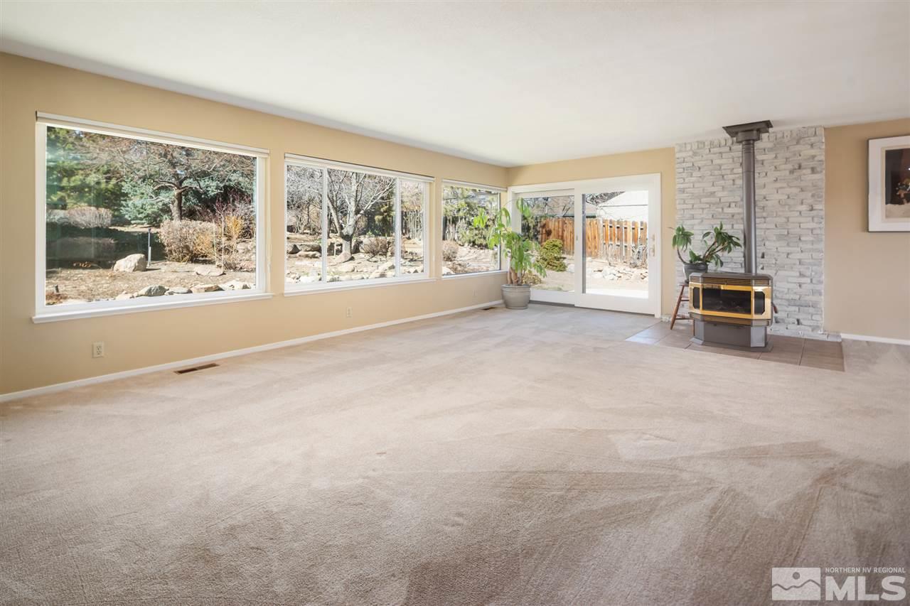 13100 Fellowship Way Reno, NV 89511 - Photo 4 of 40 en empty room with furniture and large windows