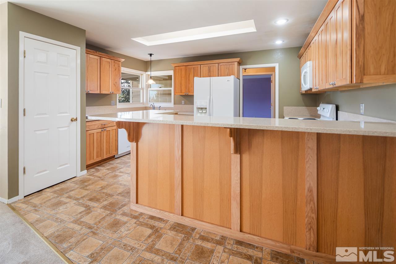 13100 Fellowship Way Reno, NV 89511 - Photo 8 of 40 a kitchen with stainless steel appliances a refrigerator and sink