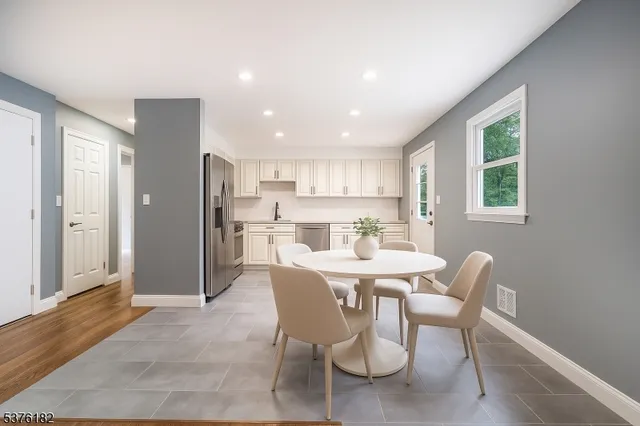 a view of a dining room with furniture and window