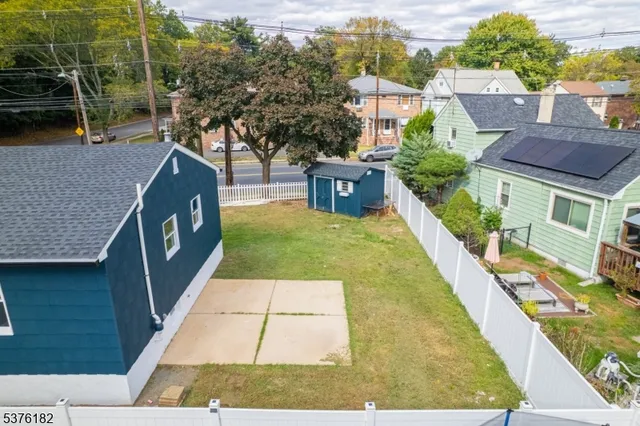 a view of house with yard