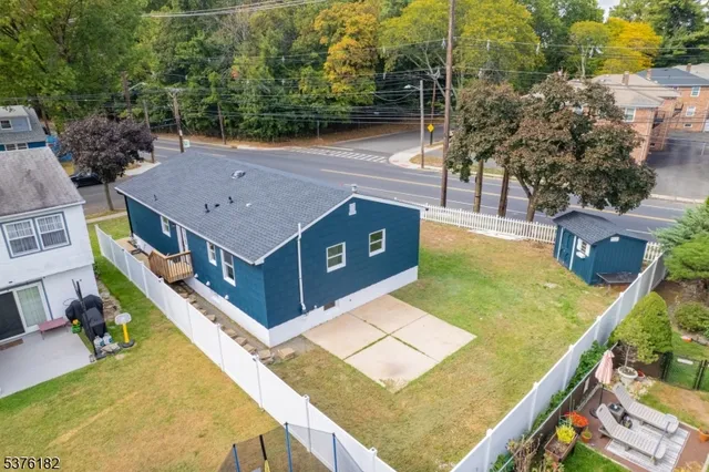 an aerial view of a house with swimming pool
