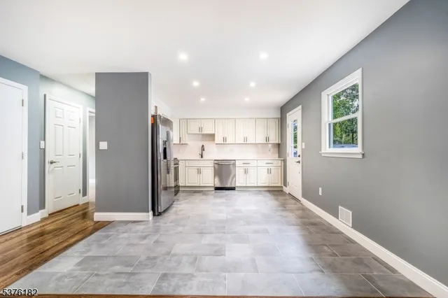 a view of a kitchen with windows