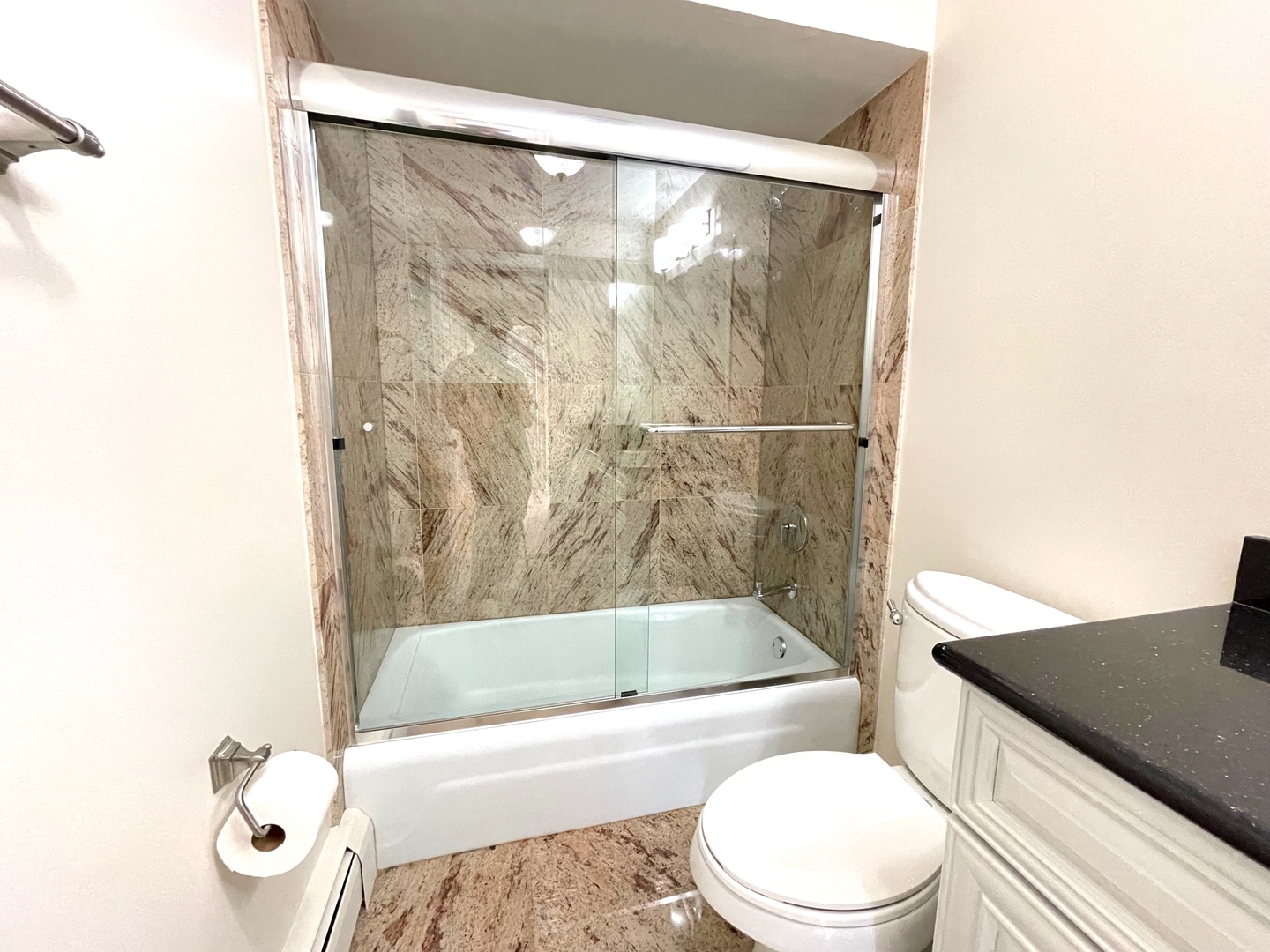 1258 Brown Street, Unit 302 Des Plaines, IL 60016 - Photo 12 of 17 a bath room with a toilet and a bath tub