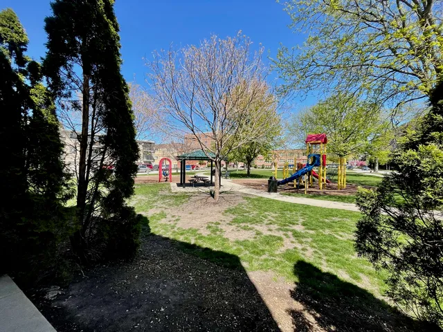 a view of yard with swimming pool and green space