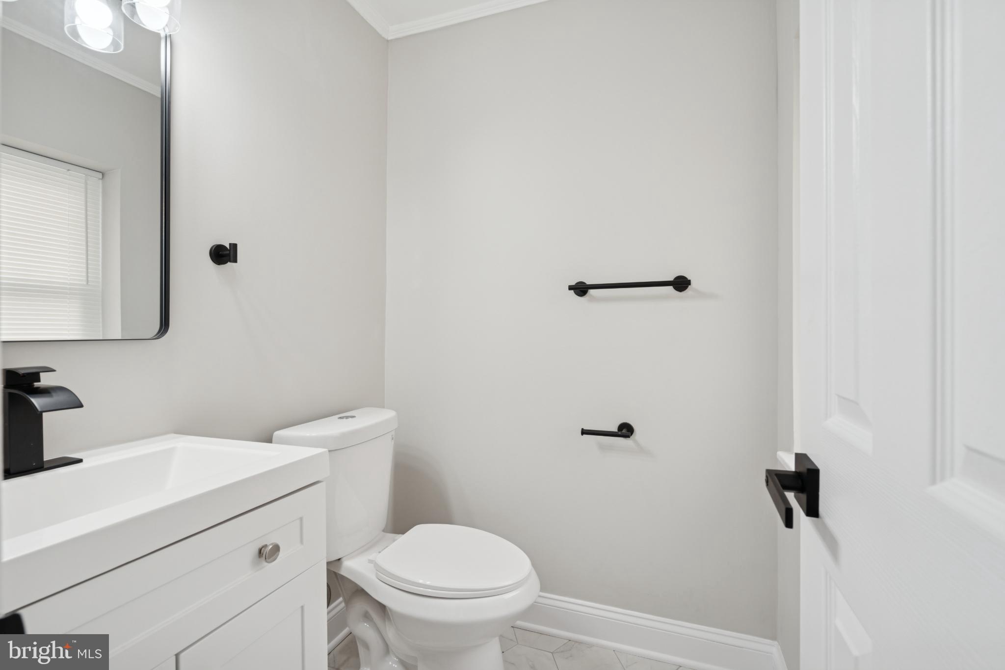 11909 Tarragon Road, Unit D Reisterstown, MD 21136 - Photo 13 of 14 Sleek modern bathroom with elegant finishes.