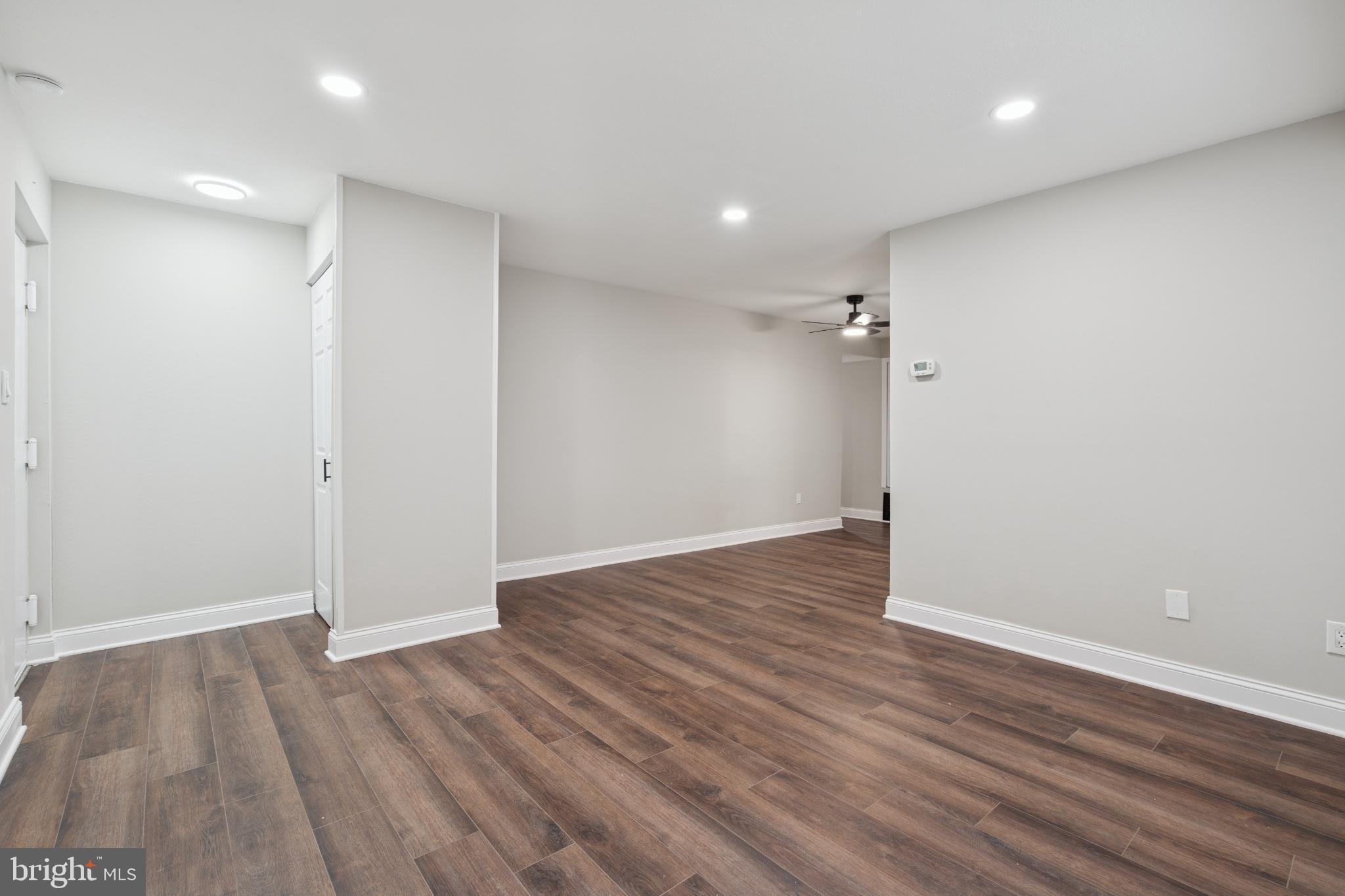 11909 Tarragon Road, Unit D Reisterstown, MD 21136 - Photo 3 of 14 Spacious, modern living area with warm tones.