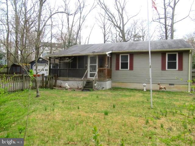 665 Flagstaff Road Lusby, MD 20657 - Photo 1 of 11 a front view of a house with a yard
