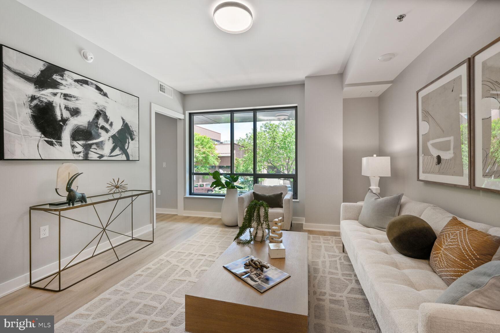 950 3rd Street Northwest, Unit 402 Washington, DC 20001 - Photo 29 of 37 a living room with furniture and a large window