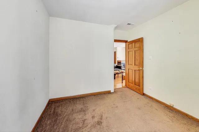 a bath tub sitting next to a white sink and vanity