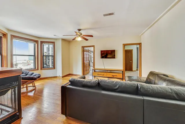 a living room with furniture and a window