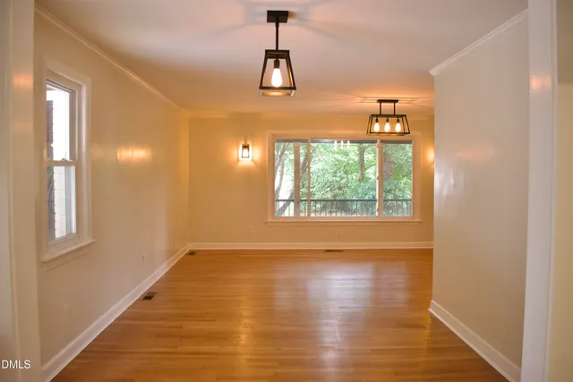 a large kitchen with cabinets and stainless steel appliances