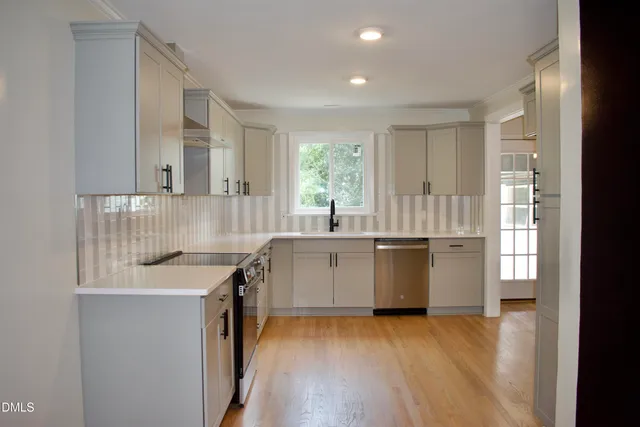a kitchen with a sink and window