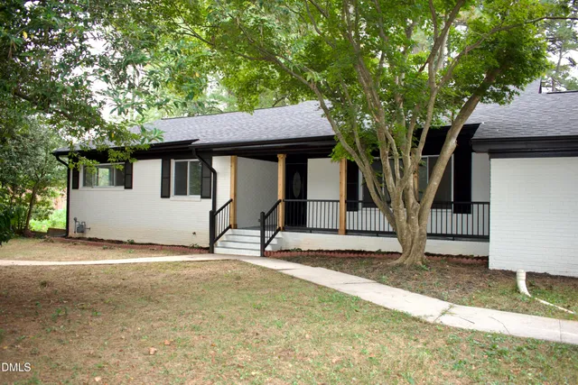 a house with trees in front of it