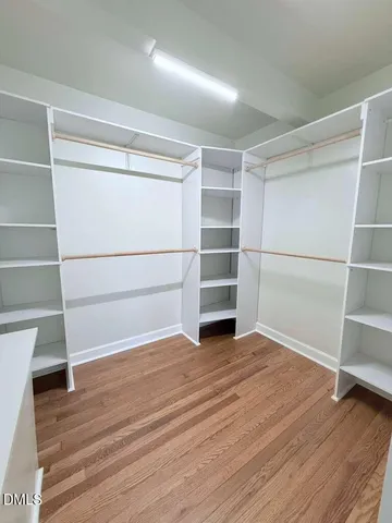 a bathroom with a sink vanity and a mirror
