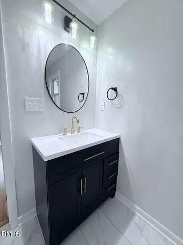 a view of an empty room with a bathroom