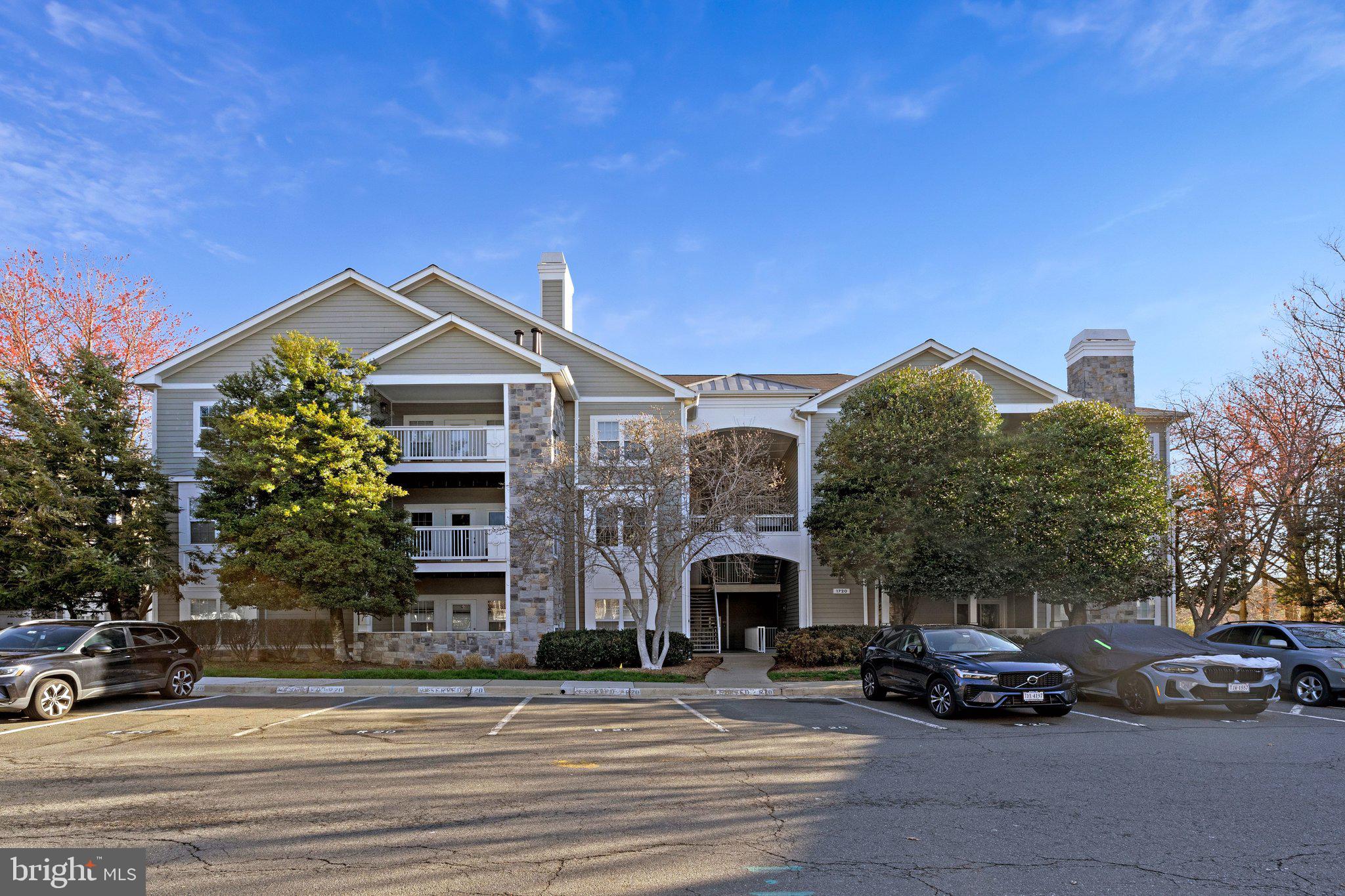 1720 Lake Shore Crest Drive, Unit 26 Reston, VA 20190 - Photo 1 of 38 a view of a car parked in front of a building