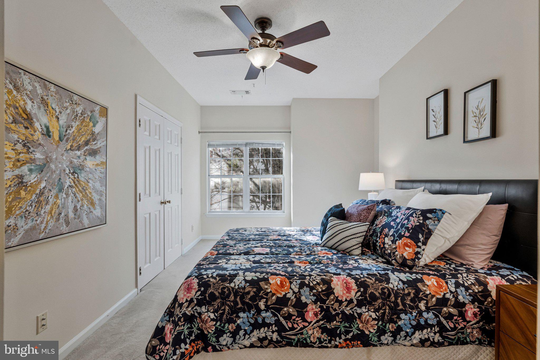 1720 Lake Shore Crest Drive, Unit 26 Reston, VA 20190 - Photo 15 of 38 a bedroom with a bed and a painting on the wall
