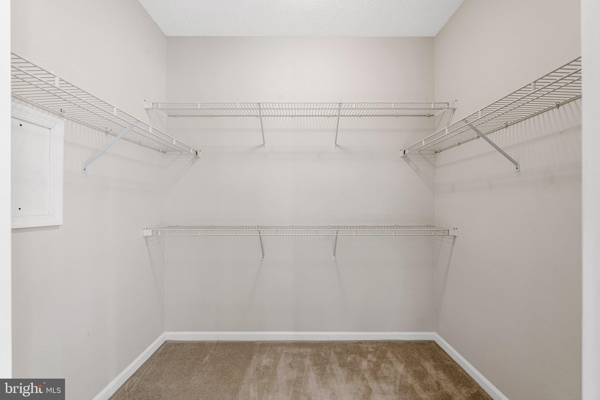 1720 Lake Shore Crest Drive, Unit 26 Reston, VA 20190 - Photo 16 of 38 a view of a room with racks on the wall