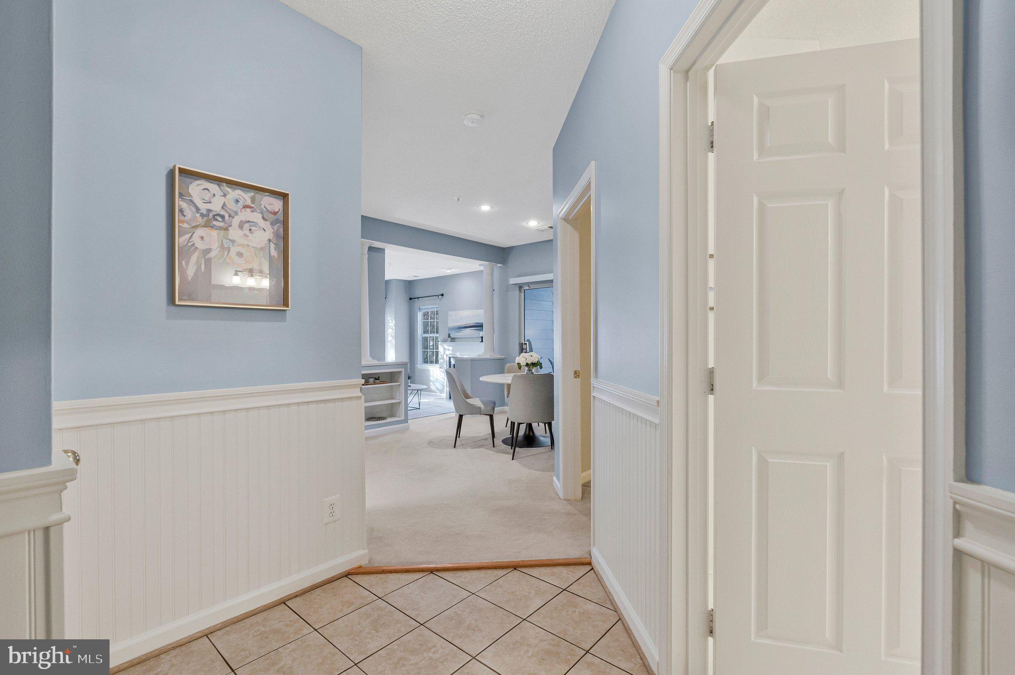1720 Lake Shore Crest Drive, Unit 26 Reston, VA 20190 - Photo 2 of 38 a living room with furniture and a table