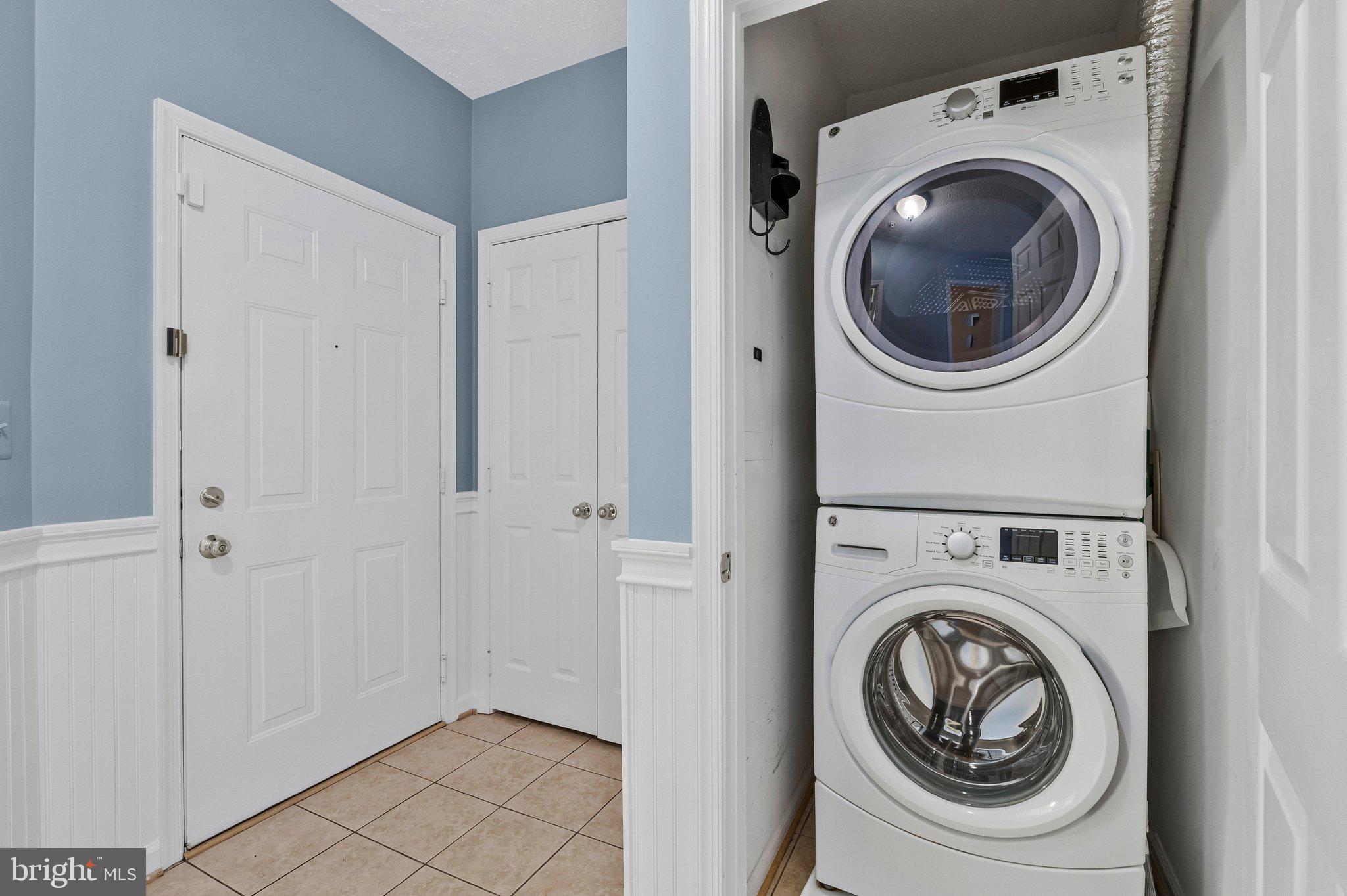 1720 Lake Shore Crest Drive, Unit 26 Reston, VA 20190 - Photo 23 of 38 a utility room with dryer and washer