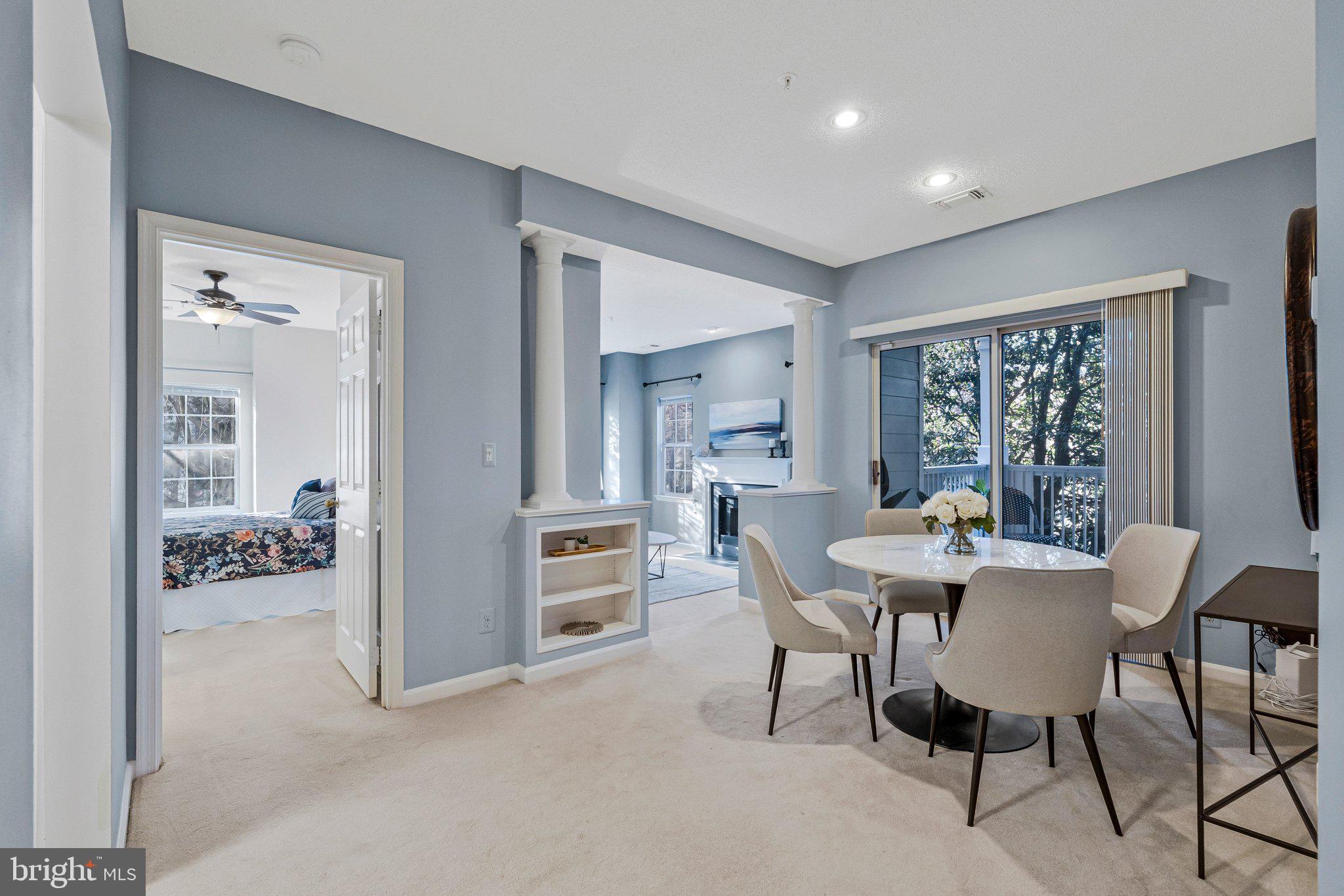 1720 Lake Shore Crest Drive, Unit 26 Reston, VA 20190 - Photo 3 of 38 a view of a dining room with furniture window and outside view