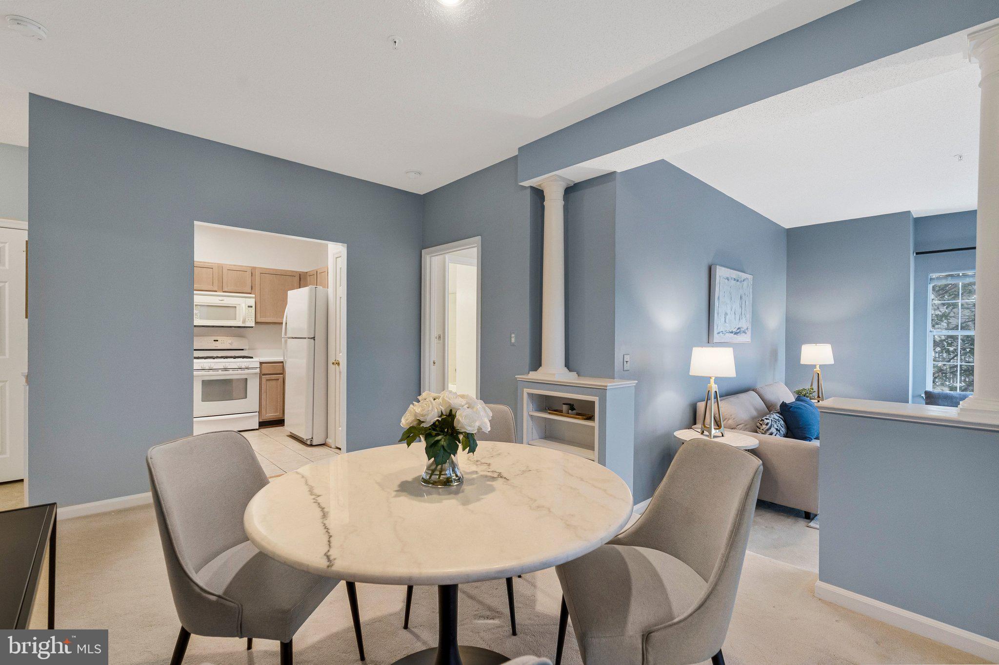 1720 Lake Shore Crest Drive, Unit 26 Reston, VA 20190 - Photo 6 of 38 a view of a dining room with furniture and window