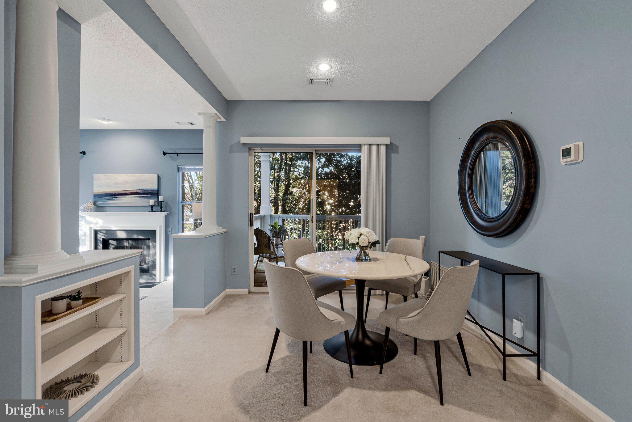 1720 Lake Shore Crest Drive, Unit 26 Reston, VA 20190 - Photo 7 of 38 a view of a dining room with furniture window and wooden floor