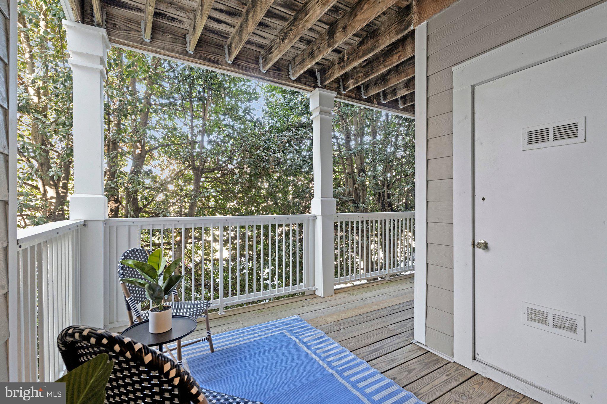 1720 Lake Shore Crest Drive, Unit 26 Reston, VA 20190 - Photo 10 of 38 a balcony with wooden floor in outdoor space