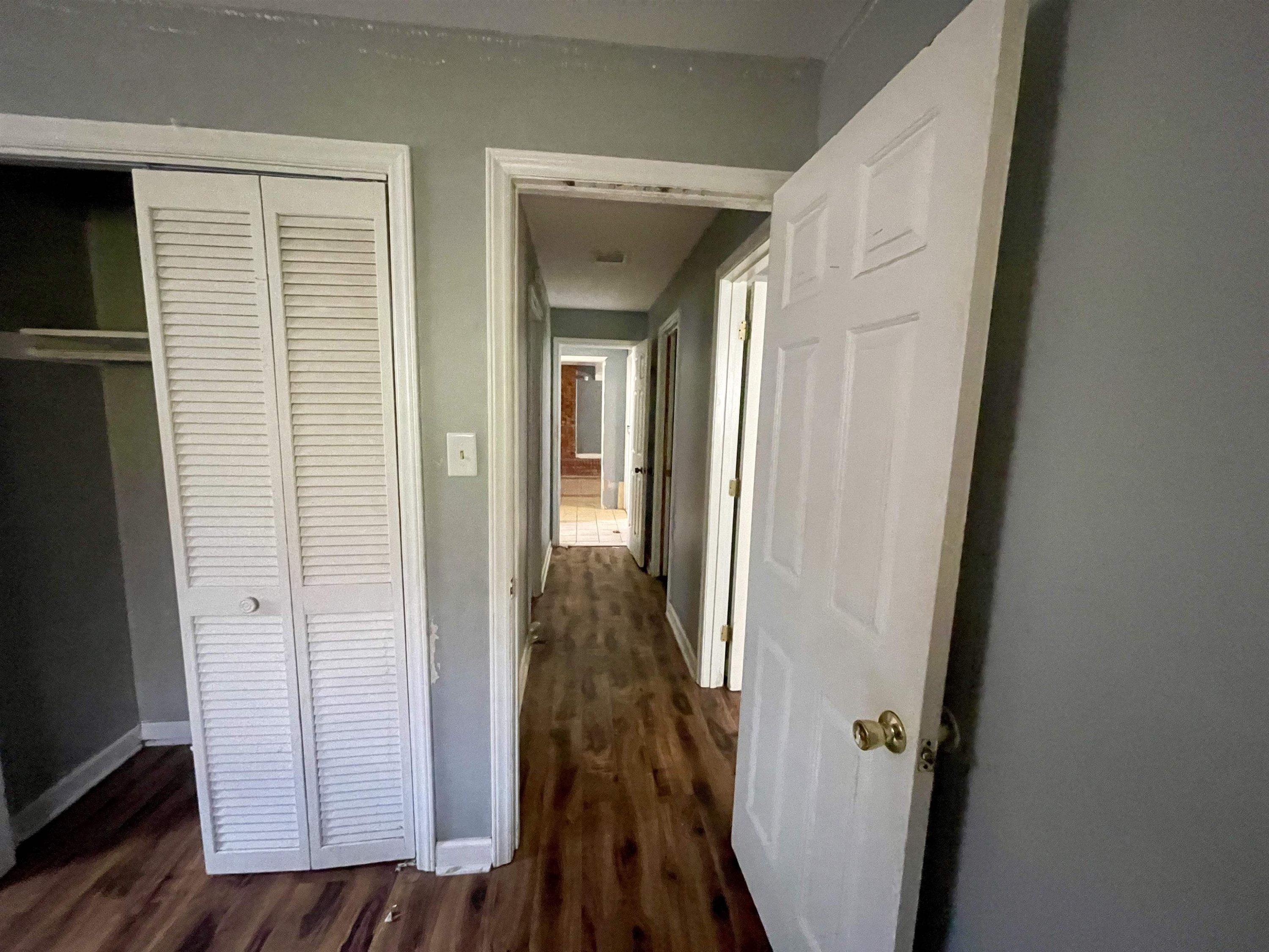 5017 Robinwood Road Durham, NC 27713 - Photo 13 of 31 a view of a hallway with wooden floor and staircase