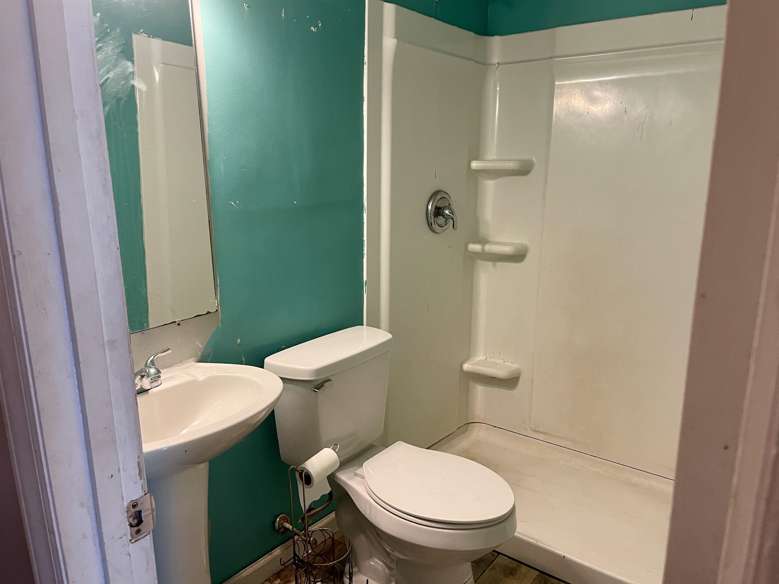 5017 Robinwood Road Durham, NC 27713 - Photo 14 of 31 a white toilet sitting next to a bathroom sink