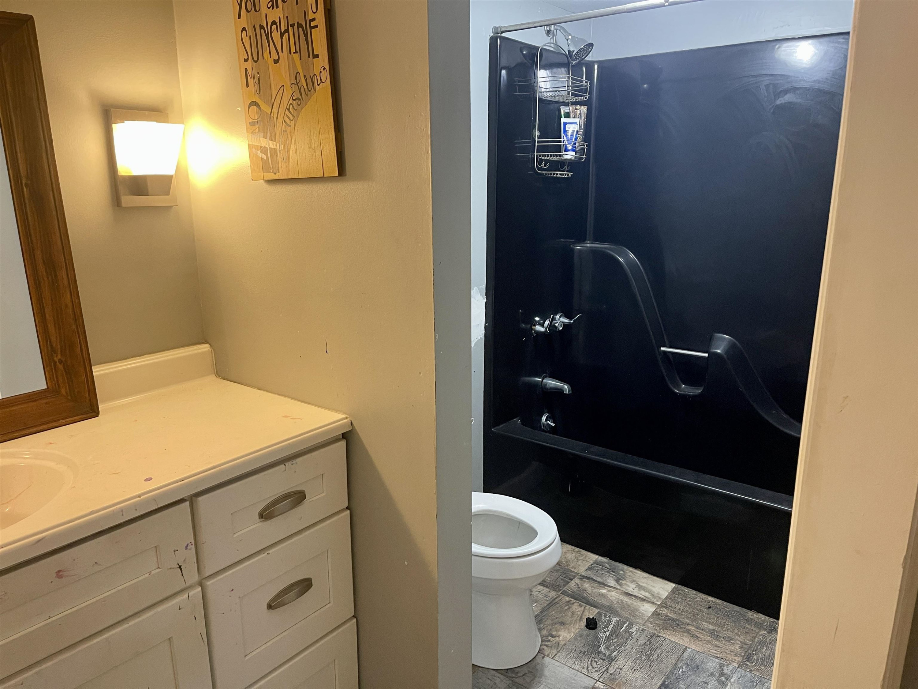 5017 Robinwood Road Durham, NC 27713 - Photo 15 of 31 a bathroom with a granite countertop sink toilet and shower