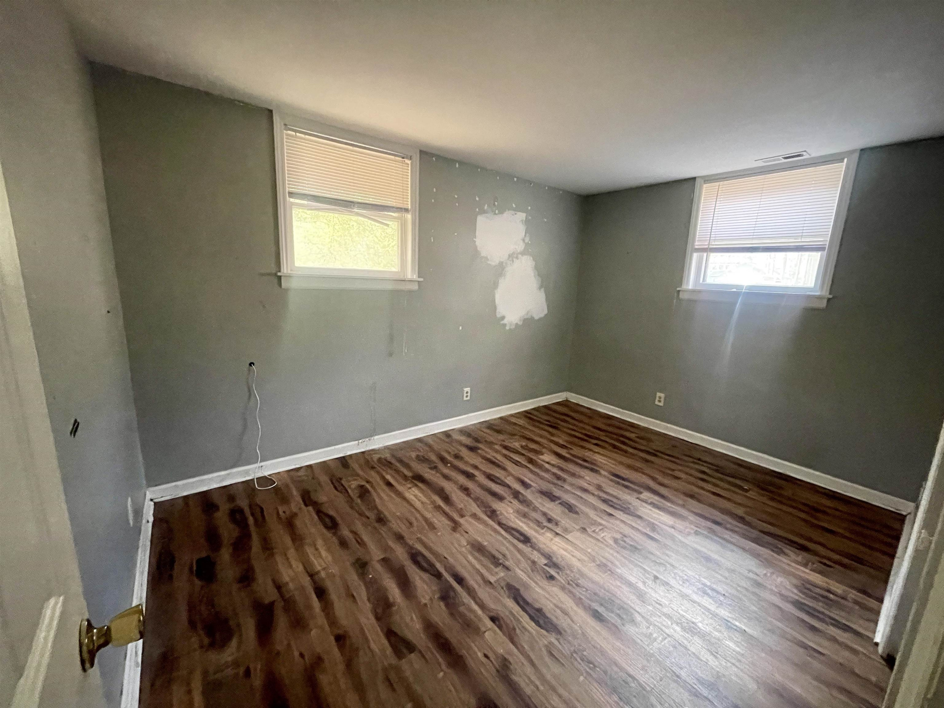 5017 Robinwood Road Durham, NC 27713 - Photo 17 of 31 a view of a room with wooden floor and window