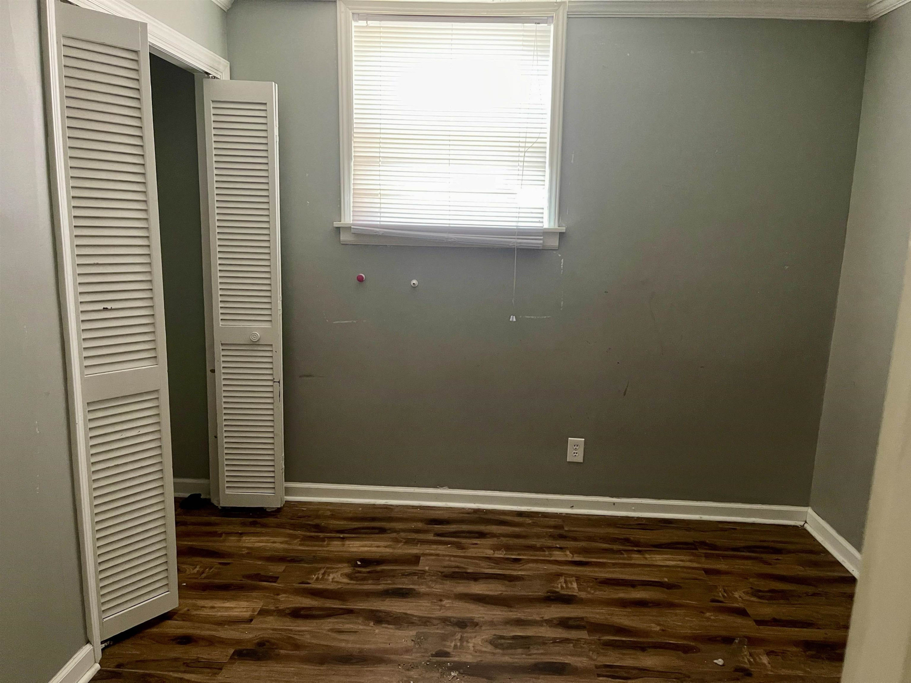5017 Robinwood Road Durham, NC 27713 - Photo 18 of 31 a view of a room with wooden floor and a window