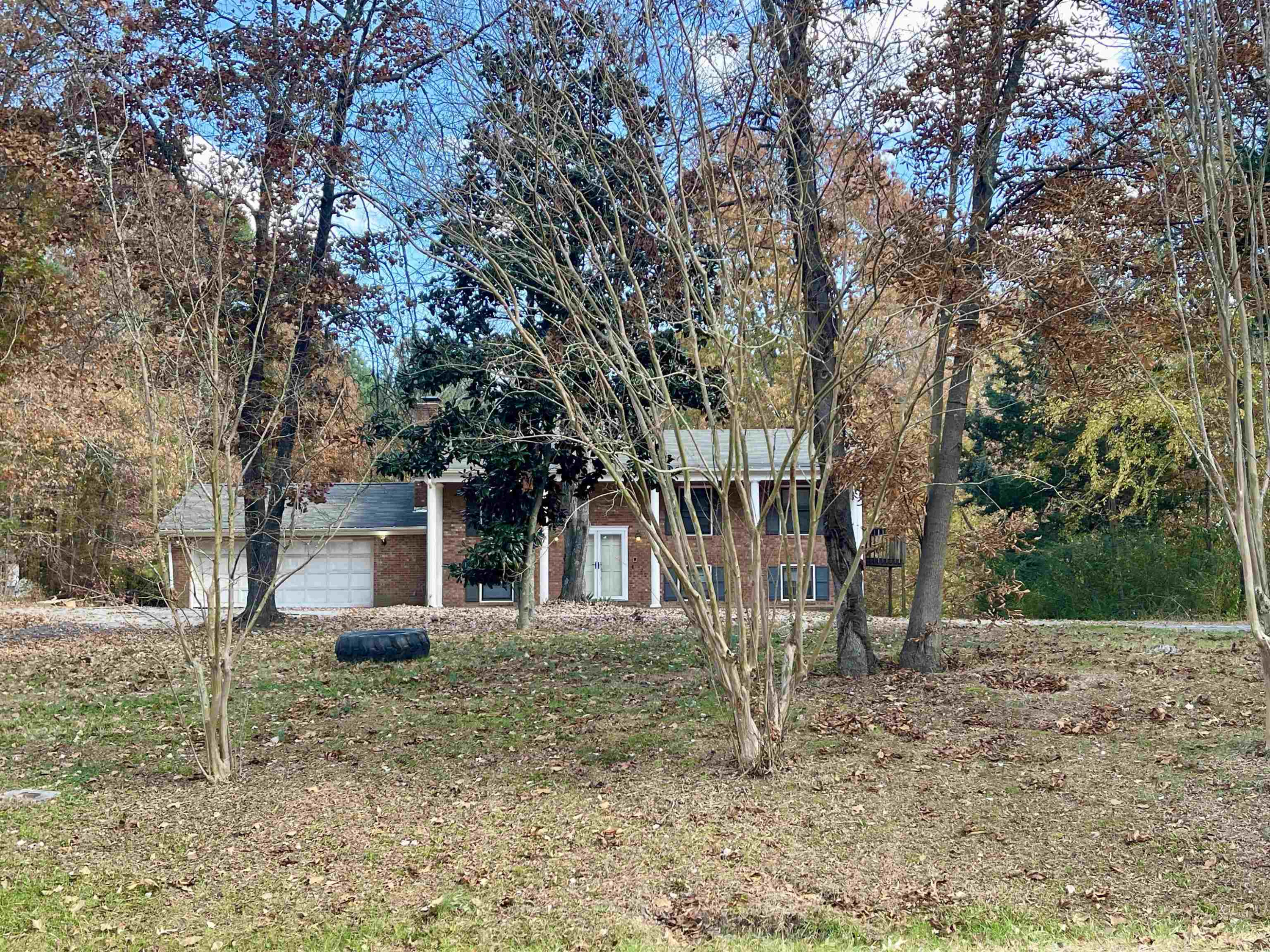 5017 Robinwood Road Durham, NC 27713 - Photo 30 of 31 a backyard of a house with lots of trees