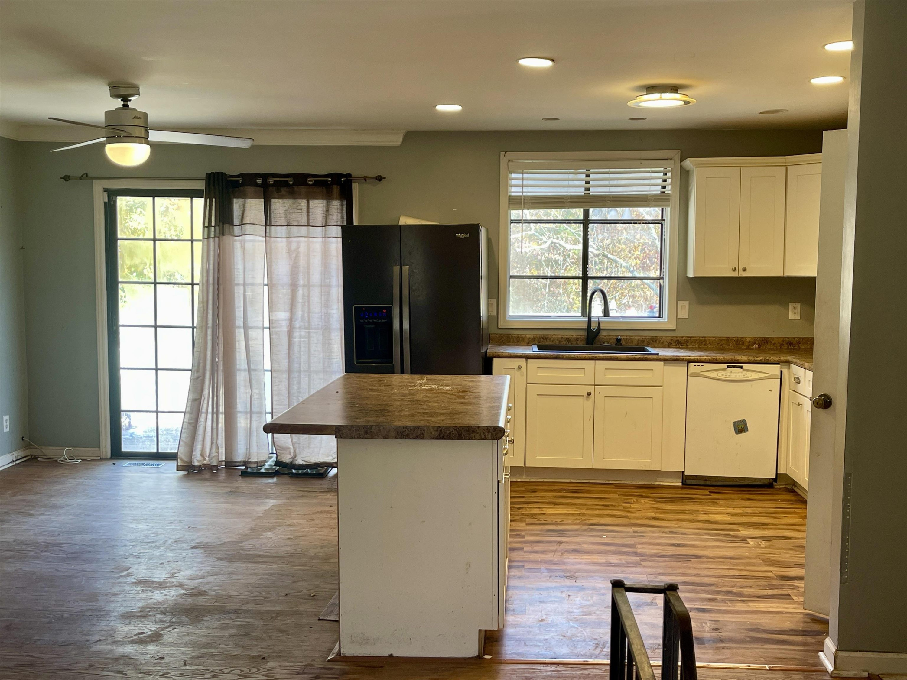 5017 Robinwood Road Durham, NC 27713 - Photo 4 of 31 a kitchen with stainless steel appliances granite countertop a sink a stove and refrigerator