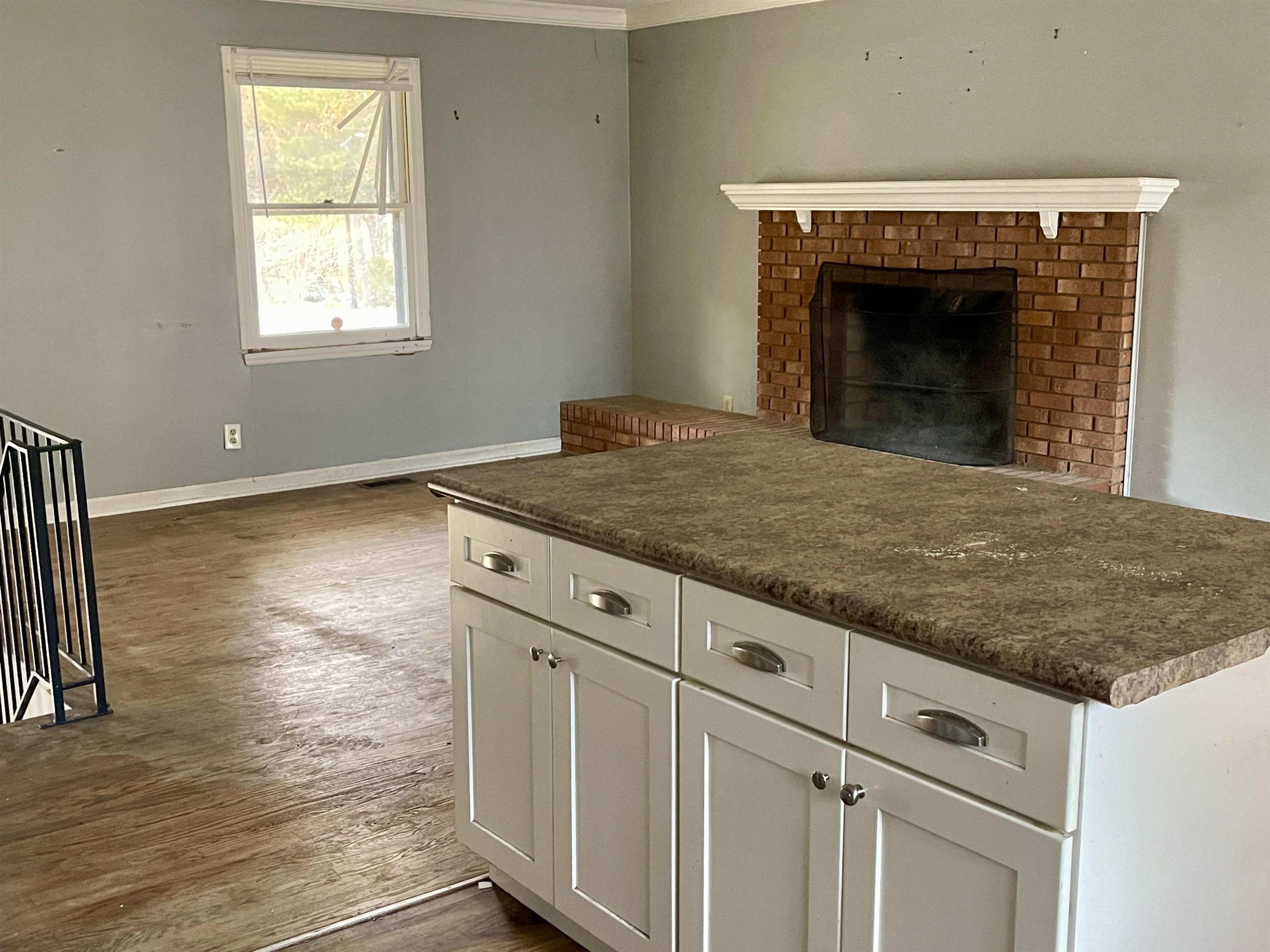 5017 Robinwood Road Durham, NC 27713 - Photo 7 of 31 a view of kitchen with granite countertop window and a fireplace