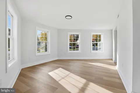 a view of livingroom with window and hardwood floor