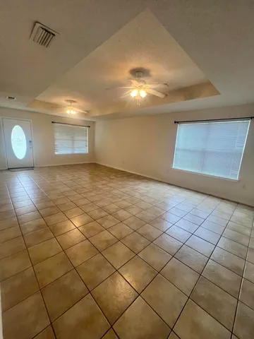 a view of a livingroom and window